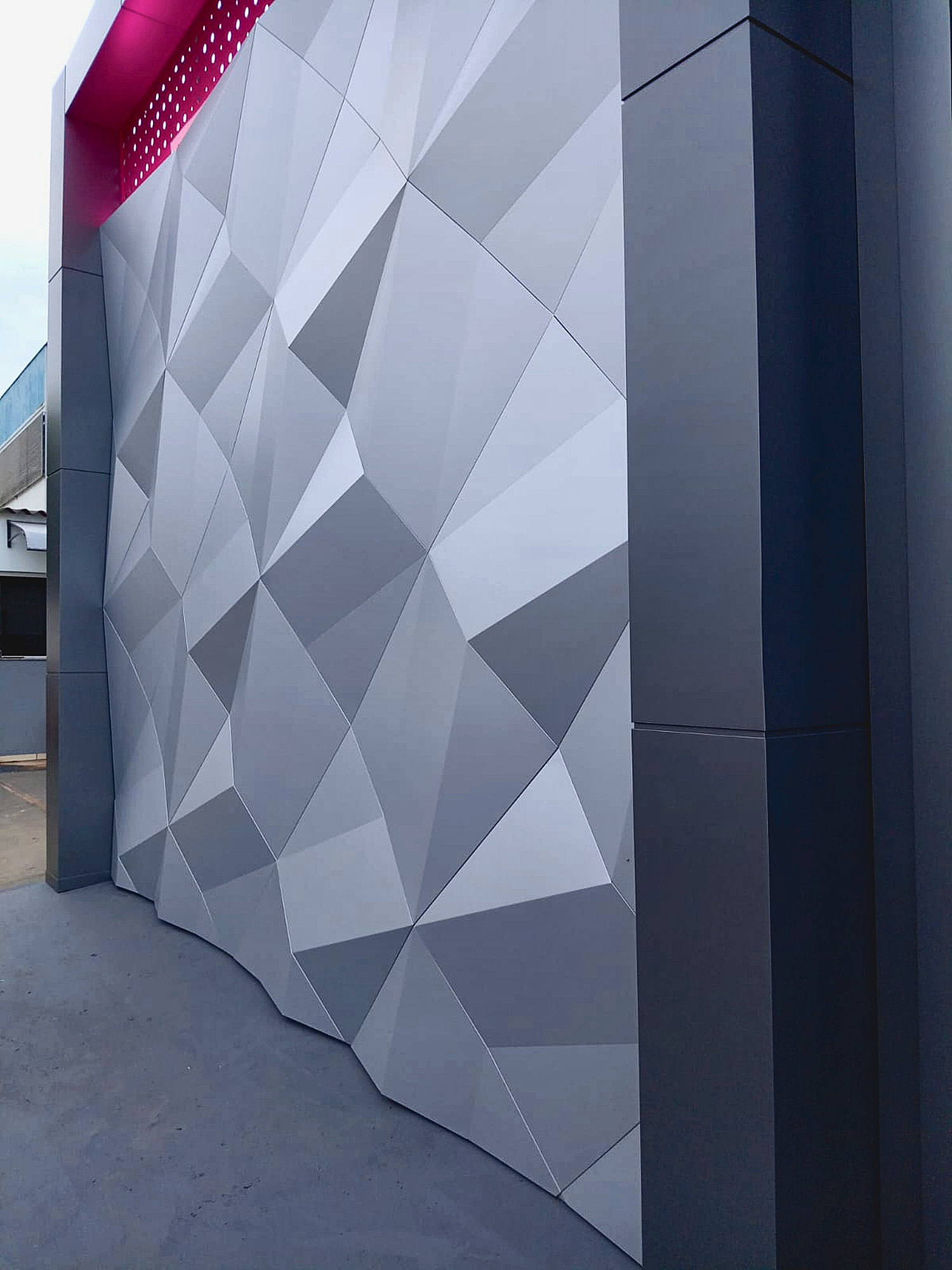 Faceted grey ACM wall