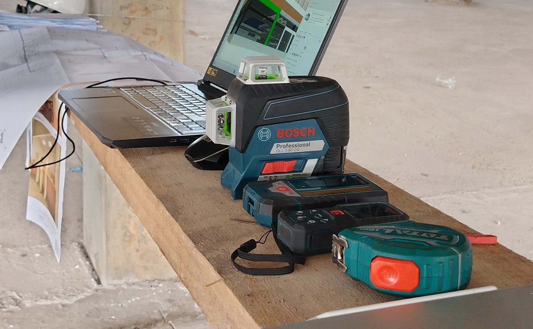 An installer in a harness on site, before work starts