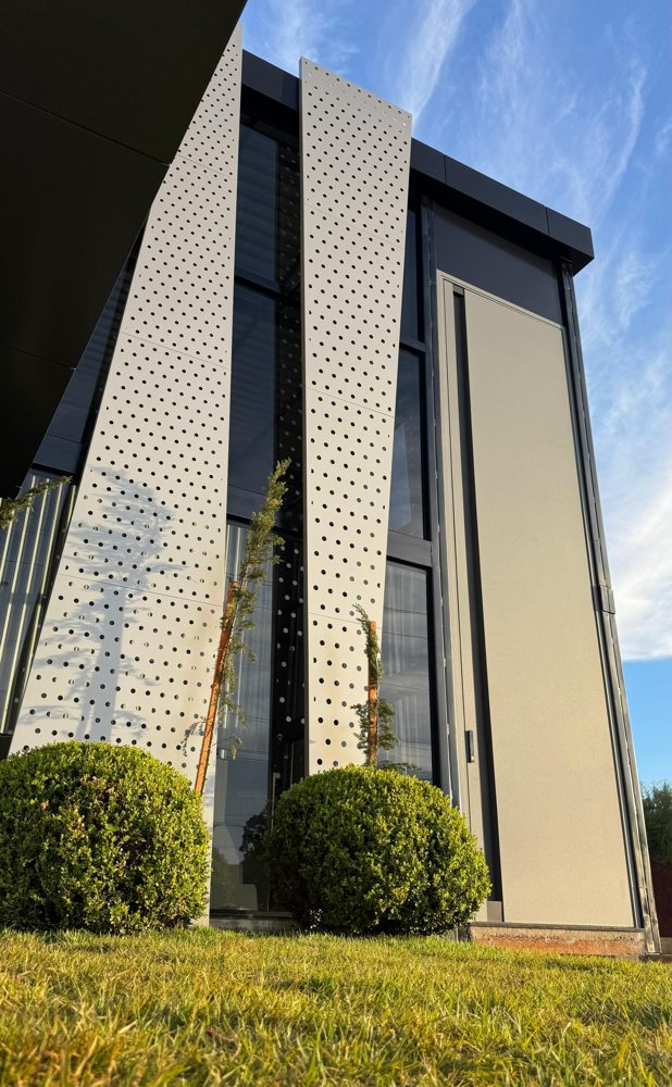 Perforated ACM and folded feature pieces on a corner
